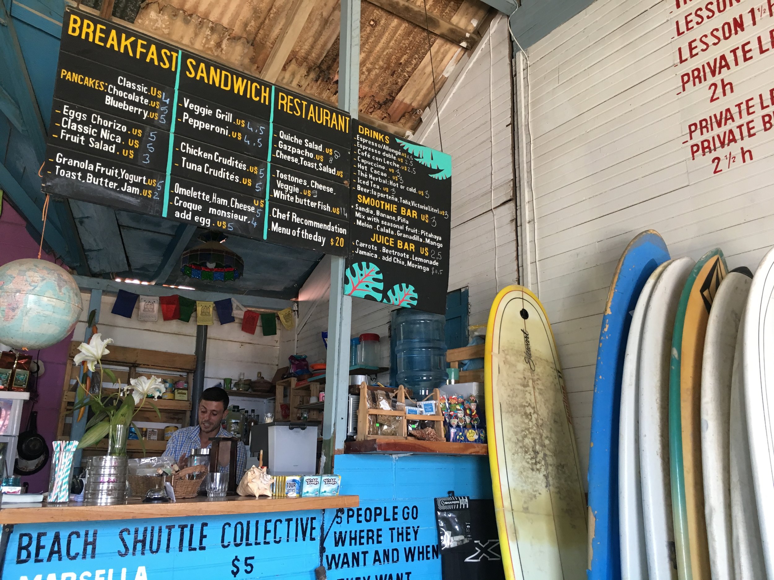  Inside O'Shop. Bastian, the owner, is behind the counter preparing smoothies. 