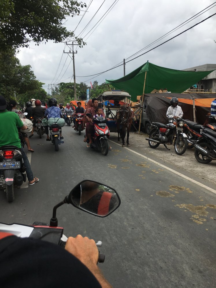  On motorbike in the busy streets of Mataram, Lombok 