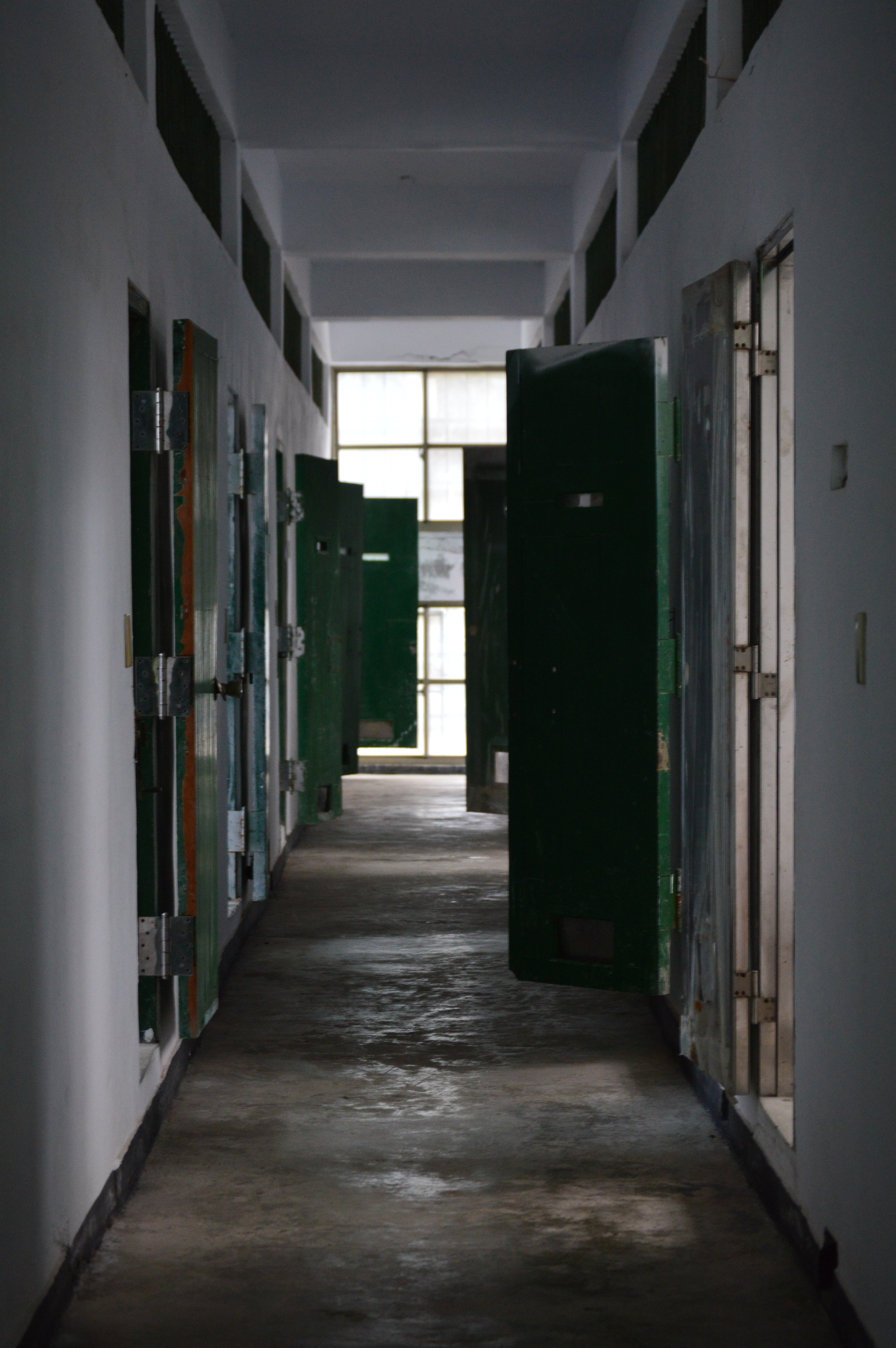  The north wing of the jail. Vacant cells with a couple doors left open. 
