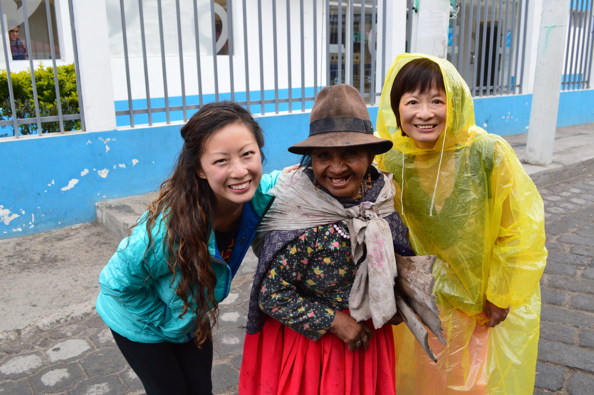  It began drizzling and my mom threw on her bright yellow poncho which quickly became a laughing matter for everyone we walked by. This lady was so amused that she wanted a picture with us...how sweet! 