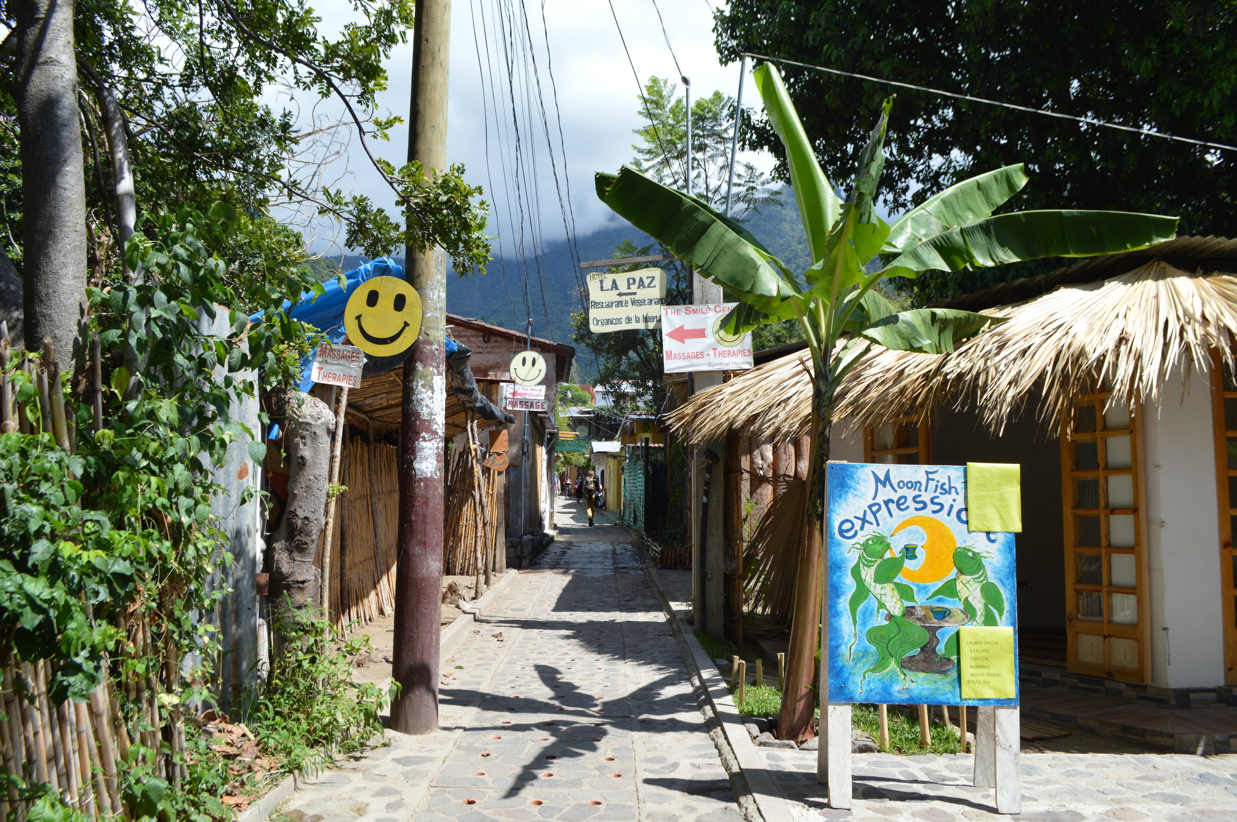 Shops and cafes left and right along the narrow street