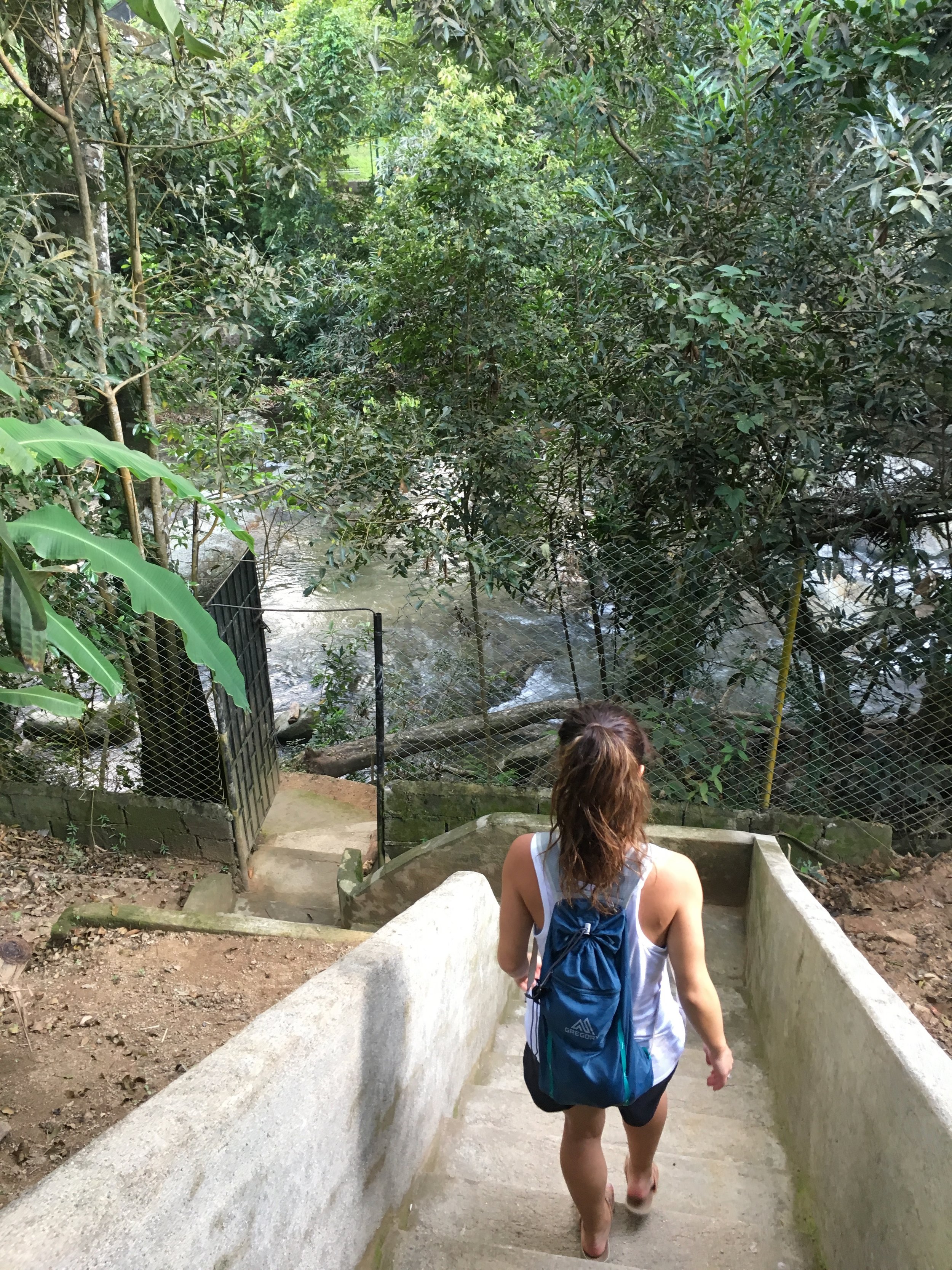  Taking the shortcut through the river to Minca city center 