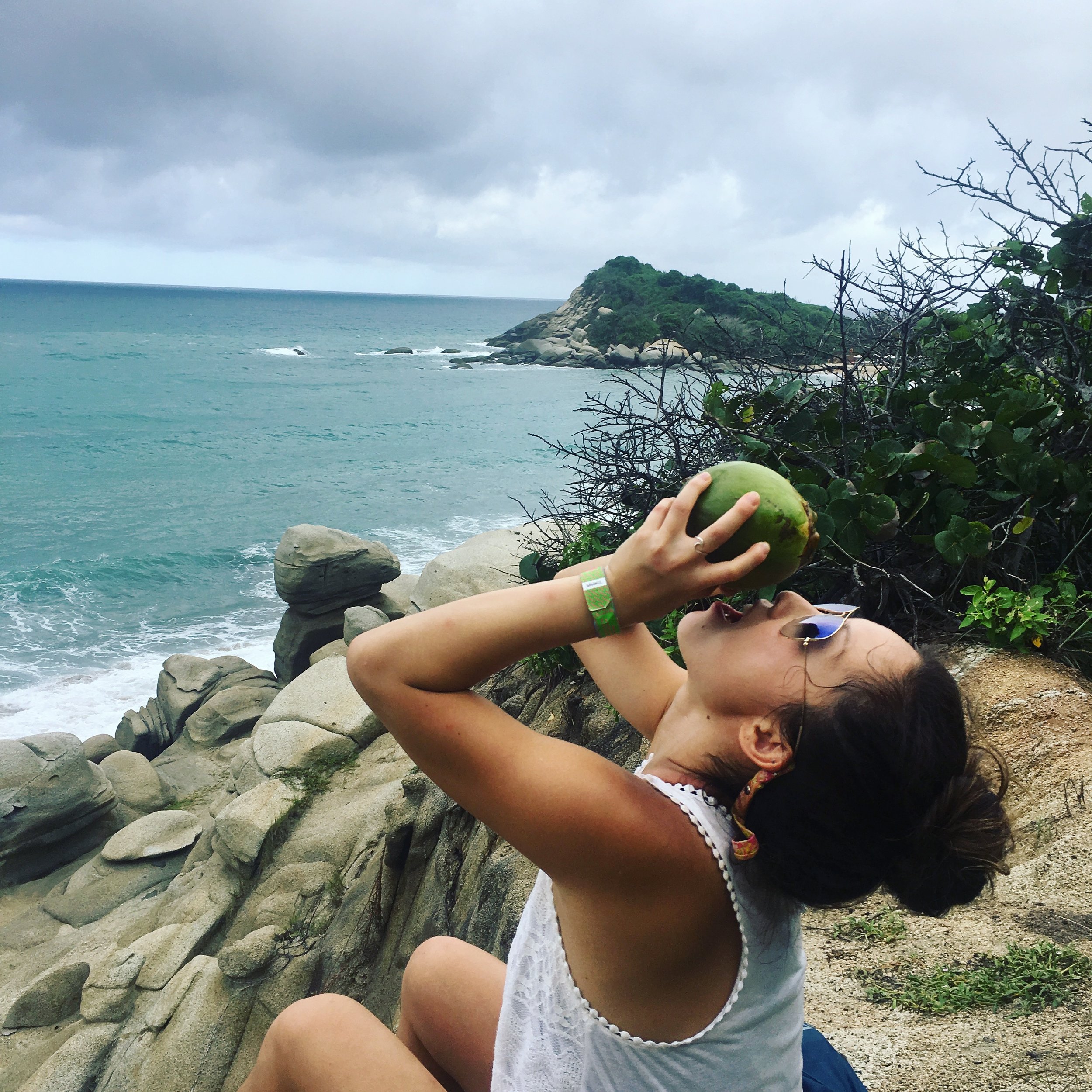  This coconut fell off the tree as we were walking. So we cracked it open on a rock and drank whatever water it had left. 