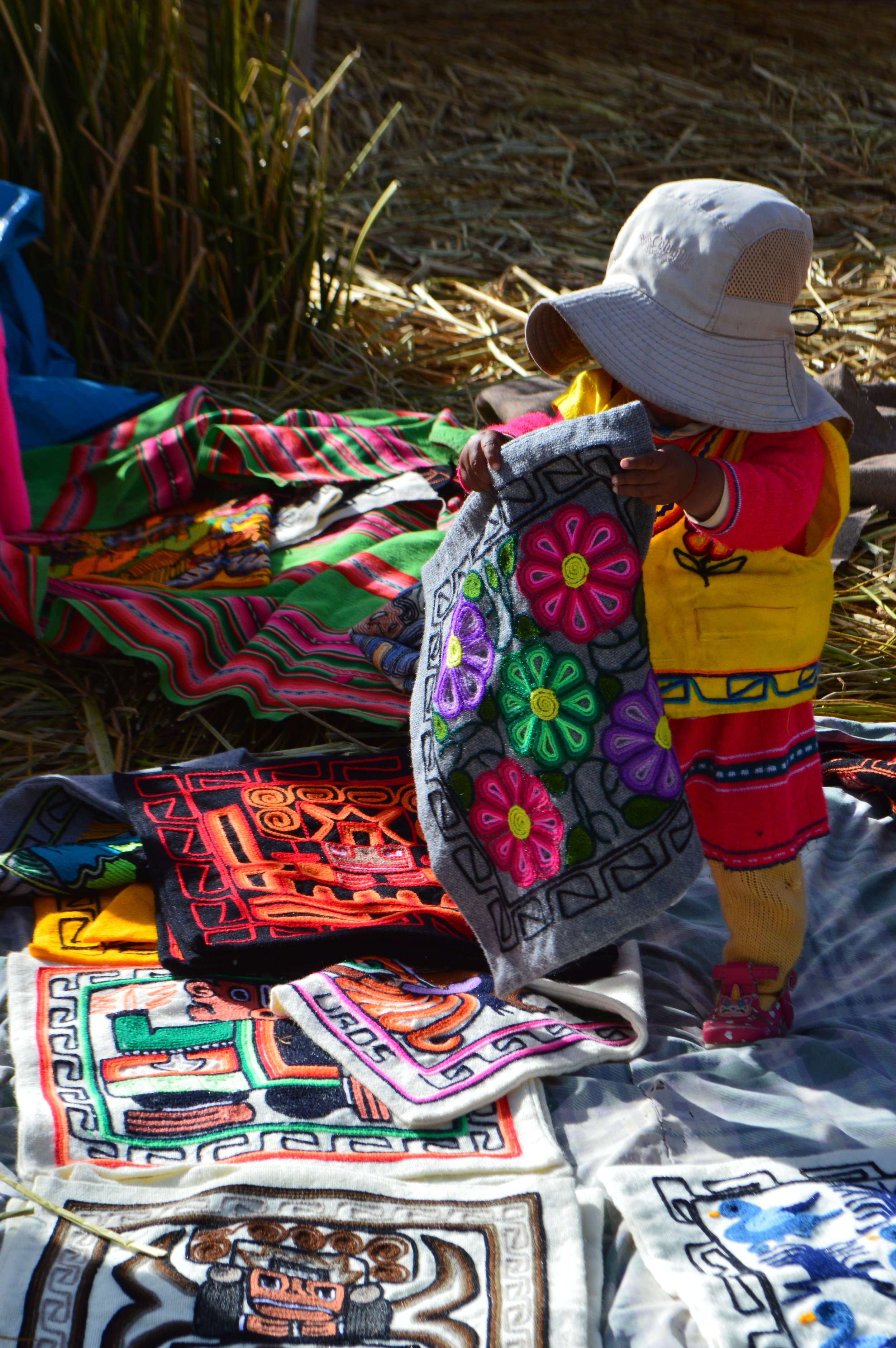 Toddler showcasing her mother’s handicraft