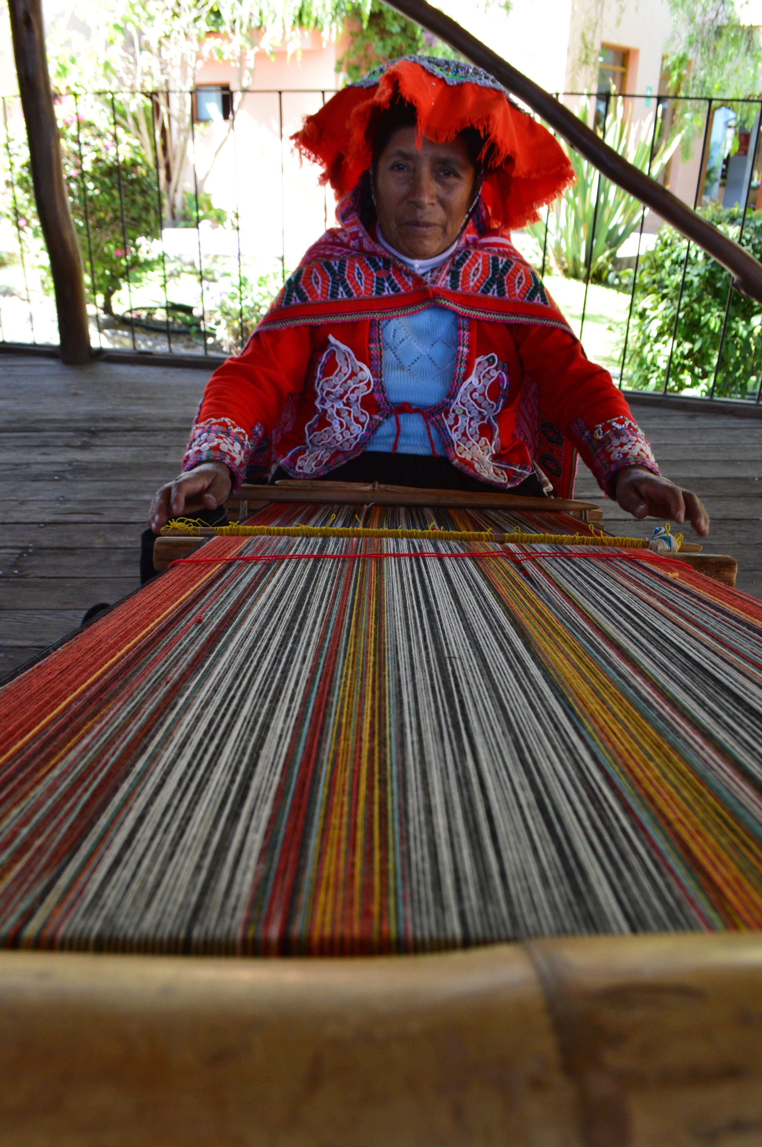 Local woman weaving a scarf